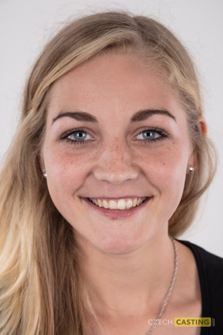 Blonde young Marcela shows her very tiny breasts wearing a black thong