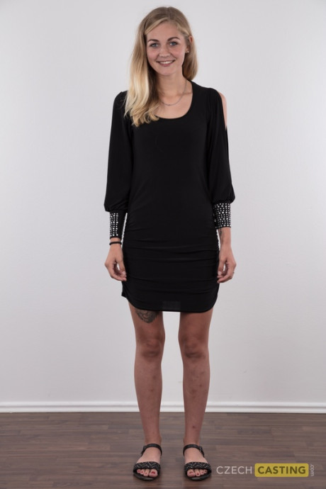 Blonde young Marcela shows her very tiny breasts wearing a black thong