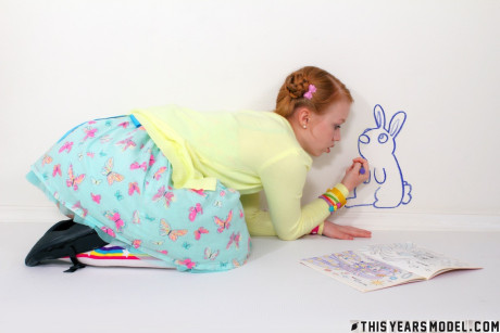 Adorable redheaded young Dolly Little gets undressed in socks and Mary Jane's