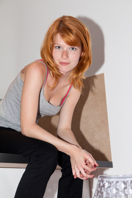 Czech ginger head Mia Sollis showcases her medium breasts and spreads her bald beaver