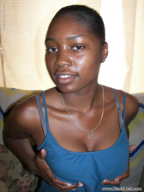 Ebony with perfect naturals London strips undressed and flaunts her hot muff