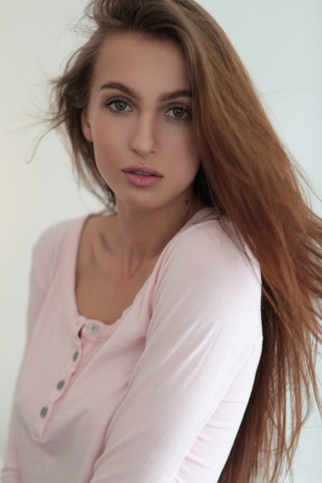 Glamorous teen Holly Haim strips and reveals her long legs and perky melons