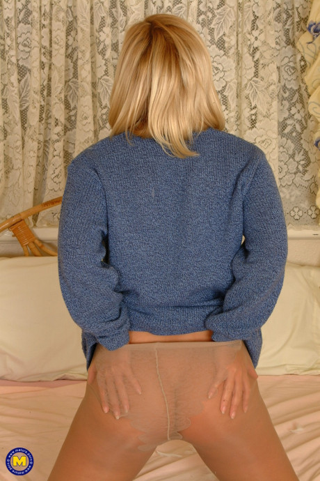 Yellow-haired MILF in pantyhose Tracey Coleman shows off her fat behind and huge boobs