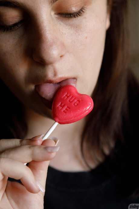 Amateur Milly Marks flaunts her incredible gigantic breasts while licking a lollipop