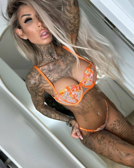 Lovely amateur babe Jacky exposing her curvy tattooed body in her underwear