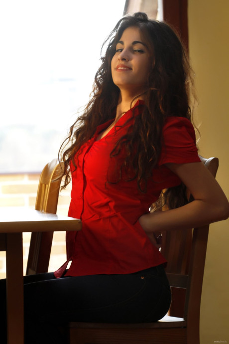 Brunette teenie Soika A slowly doffs her clothes and teases with her titties
