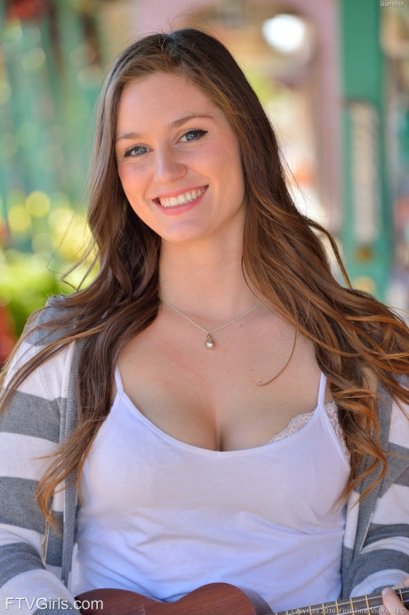 Bosomy babe Summer exposes her giant butt while playing a small guitar in public