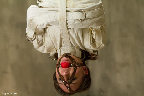 Hot Gabriella Paltrova gets dressed in a straitjacket & hung from the ceiling