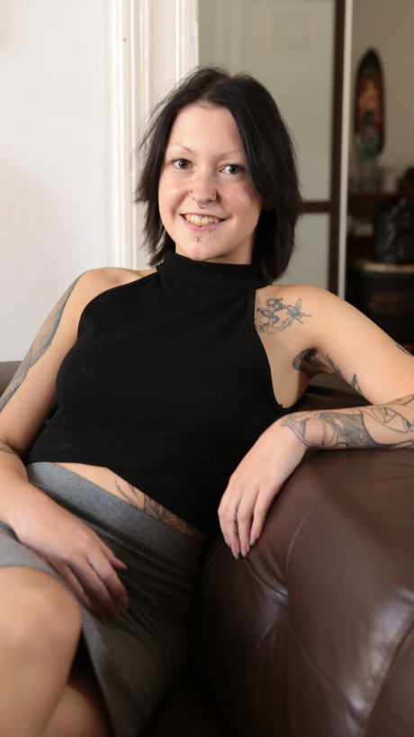 Tattooed German skank GF lady sports a ass plug while posing in the naked