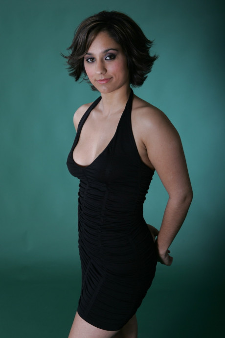 Fine brunette model Shandra posing in her provocative outfits in a solo