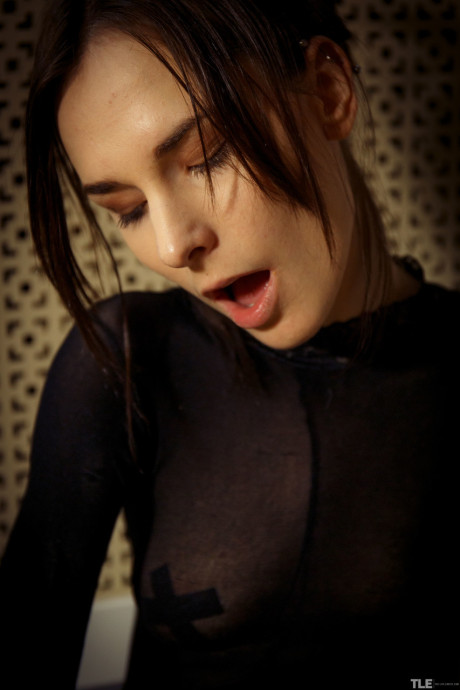 Glamorous brunette Poppy masturbates in her fine bodystocking in the washroom