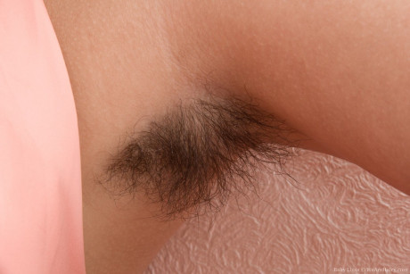 Skinny young Baby Lizza proudly exhibits silky armpits and beaver