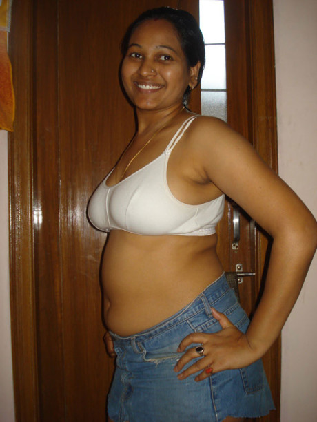 Indian plumper exposes upskirt underwear after freeing her boobs from a bra