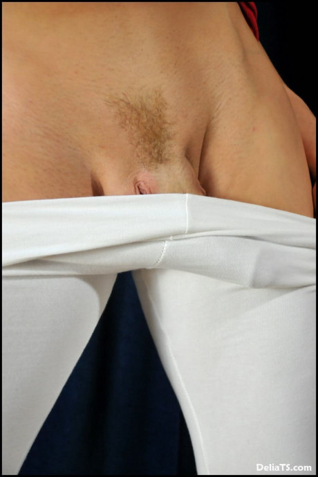 Trans lady GF girl with yellow-haired hair shows her boobies and dong in white nylons