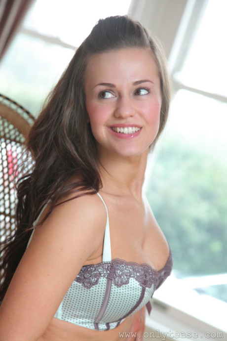 Brunette Emma K unveils her huge juicy breasts & booty while posing in her undergarment