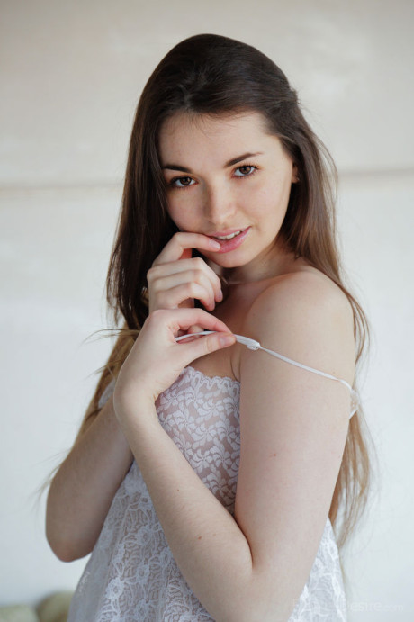 Beautiful fresh teenie Lukki Lima undressing to finger her shaved snatch to orgasm