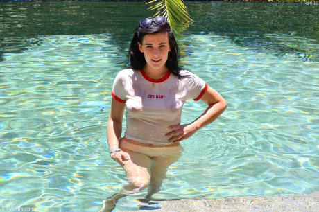 Teenie girl girlfriend lady with black hair mounts a dildo before showing her unprotected ass in a pool