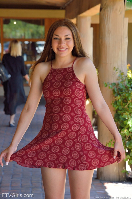 Skinny teenie Kelly hikes her dress up before fingering and toying her holes