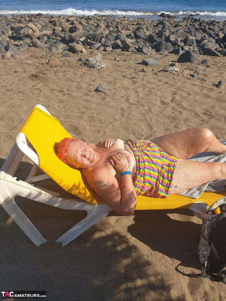 Cougar SSBBW Val Gasmic dyes her hair red before exposing herself on the beach