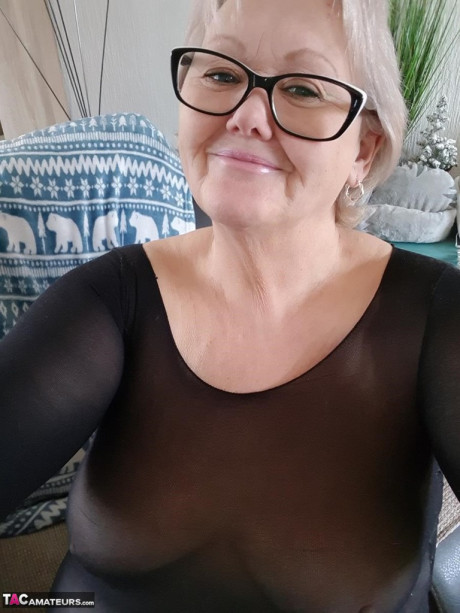 Cougar SSBBW Val Gasmic dyes her hair red before exposing herself on the beach