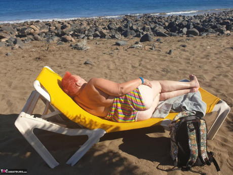 Cougar SSBBW Val Gasmic dyes her hair red before exposing herself on the beach