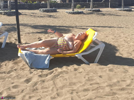 Cougar SSBBW Val Gasmic dyes her hair red before exposing herself on the beach