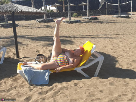 Cougar SSBBW Val Gasmic dyes her hair red before exposing herself on the beach