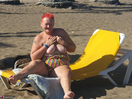 Cougar SSBBW Val Gasmic dyes her hair red before exposing herself on the beach