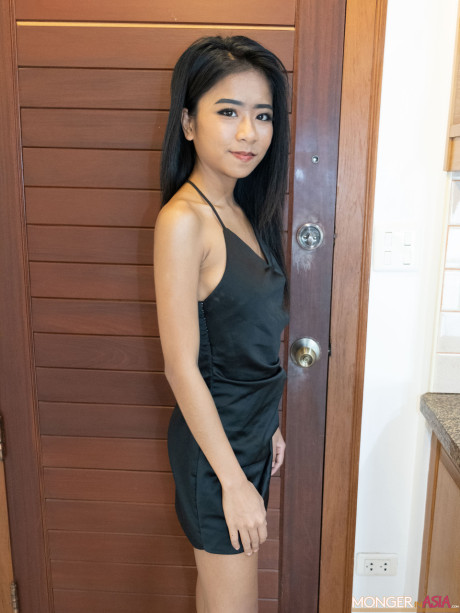 Stunning pretty asian babe Som bares her charming tasty boobies in a hot tease in fetish wear