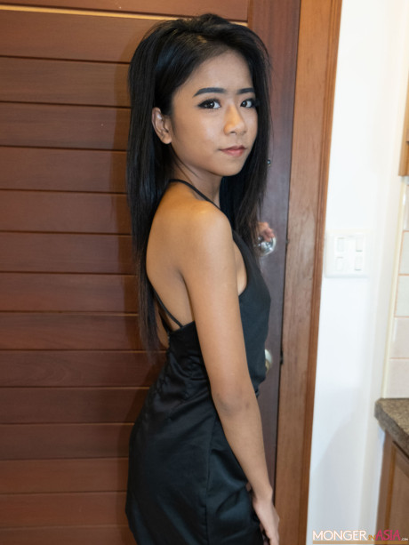 Stunning pretty asian babe Som bares her charming tasty boobies in a hot tease in fetish wear