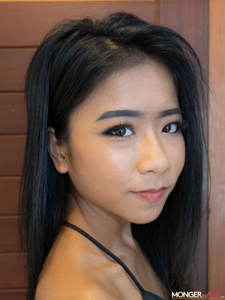 Stunning pretty asian babe Som bares her charming tasty boobies in a hot tease in fetish wear