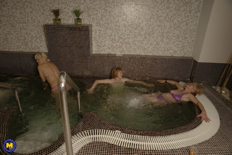 Old amateurs shower undressed at the spa and enjoy the sauna in their bikinis