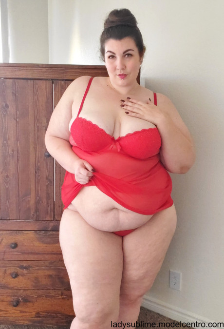 Fatty in a red negligee whore woman Sublime flaunts her large juggs while sucking a toy