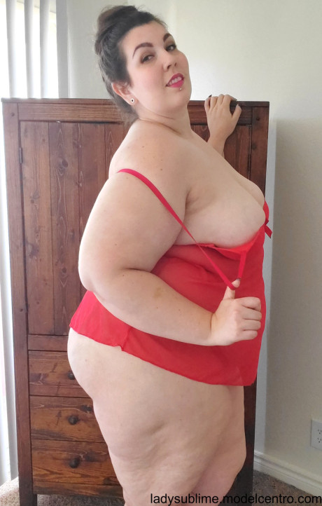 Fatty in a red negligee whore woman Sublime flaunts her large juggs while sucking a toy