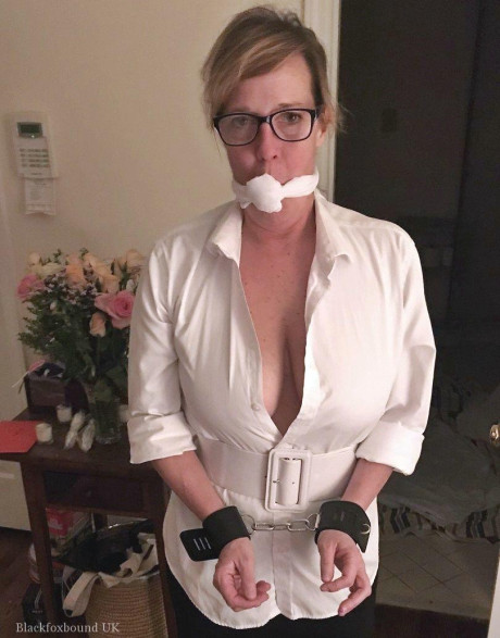 Busty lady finds herself bound and gagged in varying ways around her home