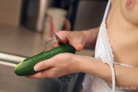 Young young cutie Nedda twerks while mostly nude in a cuisine sink