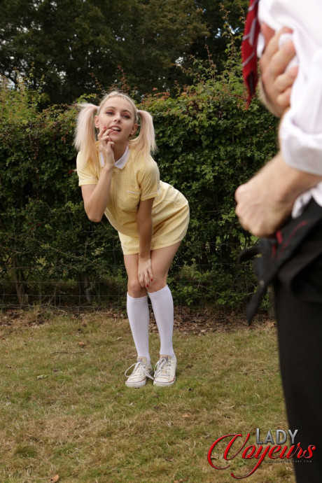 Skinny Chloe Toy exposes her adorable booty while a stud masturbates outdoors