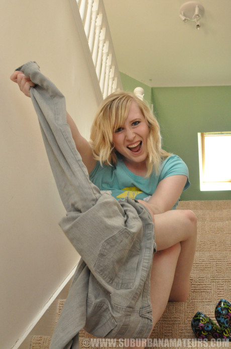 British blondie Satine Spark posing nude and fingering her twat on the stairs