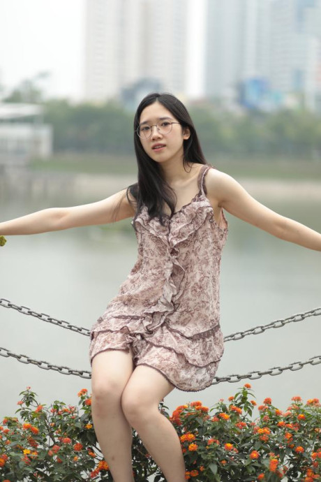 Good-looking chinese sexpot teases in a lovely short dress outdoors