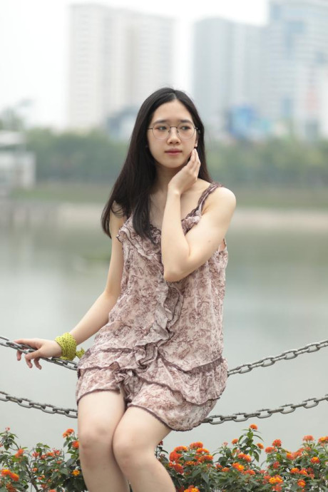 Good-looking chinese sexpot teases in a lovely short dress outdoors