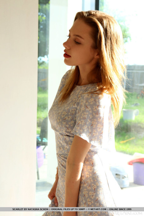 Stunning teenie Scarlet removes a long see-through dress to model in the nude