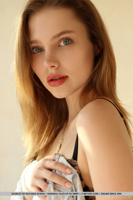 Stunning teenie Scarlet removes a long see-through dress to model in the nude