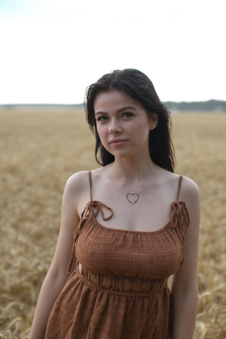 Breathtaking amateur babe Lyalya massages her big boobies in a wheat field