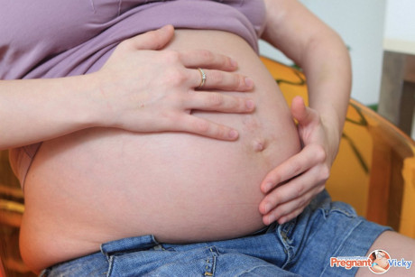 Pregnant whore gf girl spills milk over her swollen melons and massive belly
