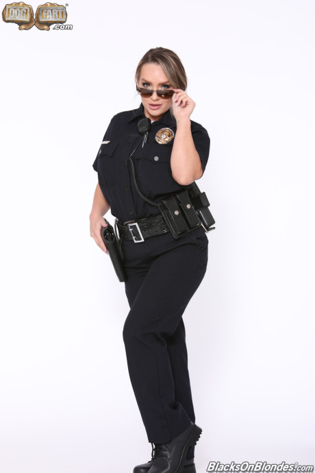 Busty cop Cali Carter gets stripped and poked by two black thieves