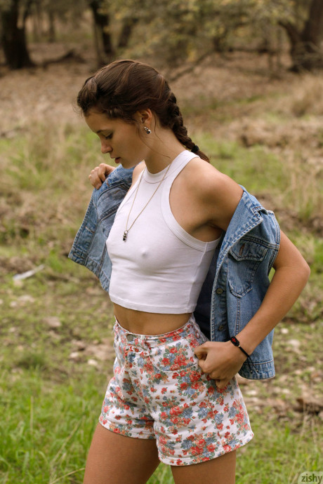 Amateur Gaby Mueller slowly removes her denim jacket and teases with her booty