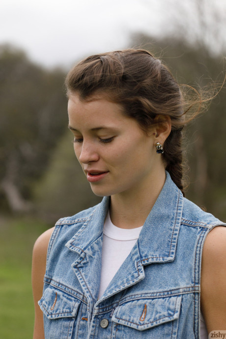 Amateur Gaby Mueller slowly removes her denim jacket and teases with her booty