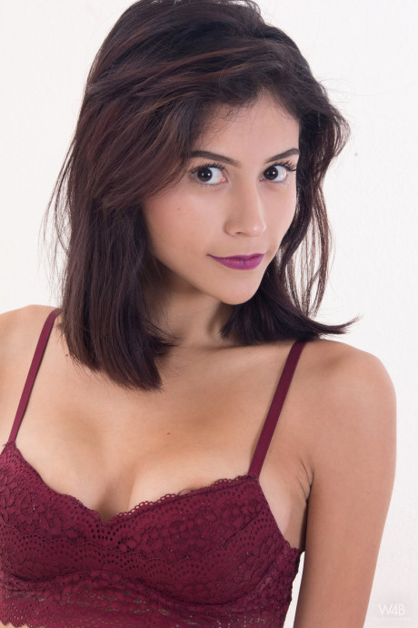 Humongous eyed Amelia Pearl displays her dark nipples and spreads her teen cunt