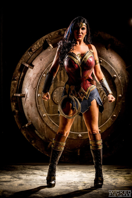 Naughty MILF in a Wonder girl costume Romi Rain gets rammed by three studs