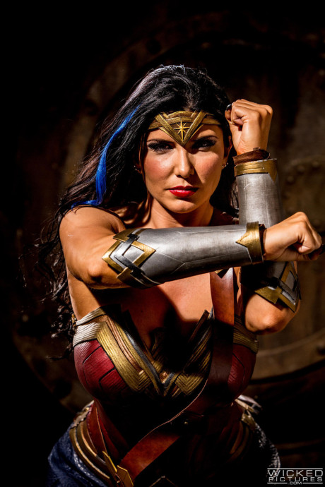 Naughty MILF in a Wonder girl costume Romi Rain gets rammed by three studs